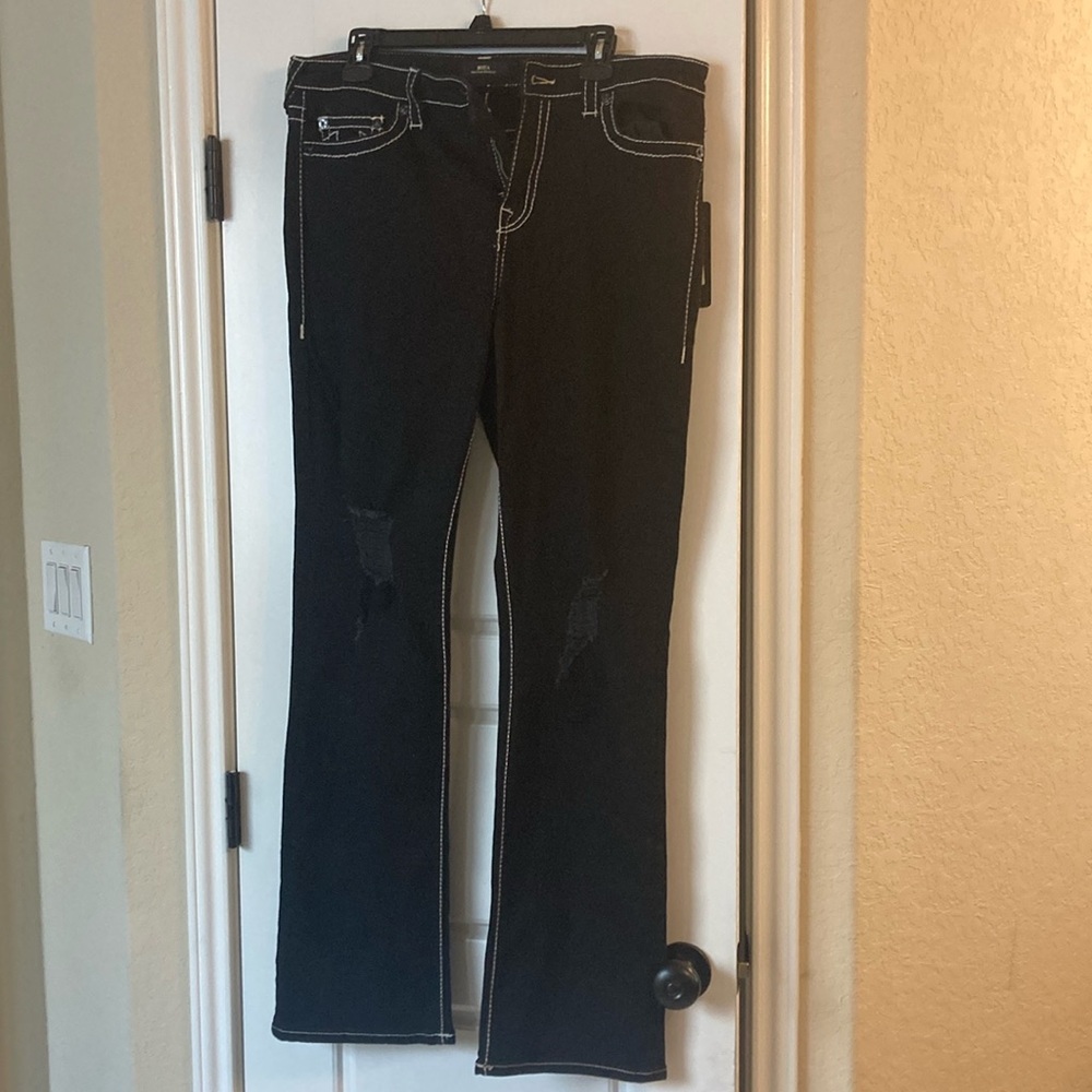 True religion.  jeans rugged legs in front